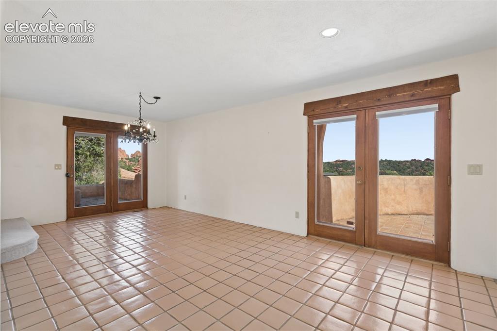 Image 20 of 46: A dining room designed for gathering, with room for a grand table and acces