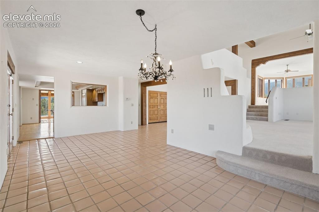 Image 21 of 46: Generously sized for memorable gatherings, the dining room connects the kit