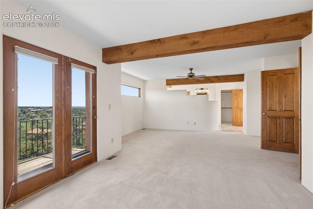 Image 38 of 46: Upstairs, the expansive primary retreat offers a private escape surrounded 