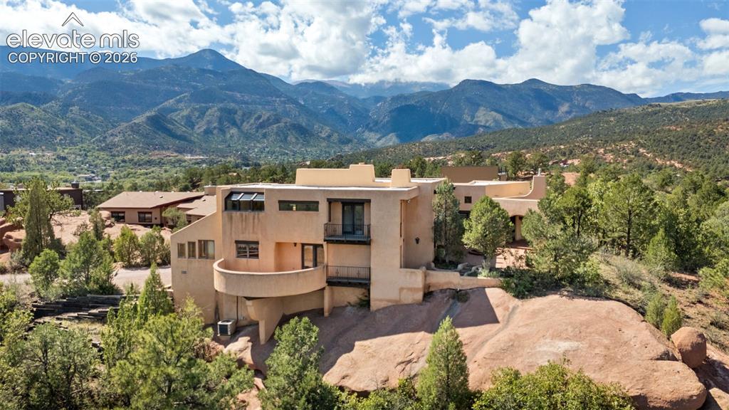 Image 4 of 46: Perched on .83 acres, the home
