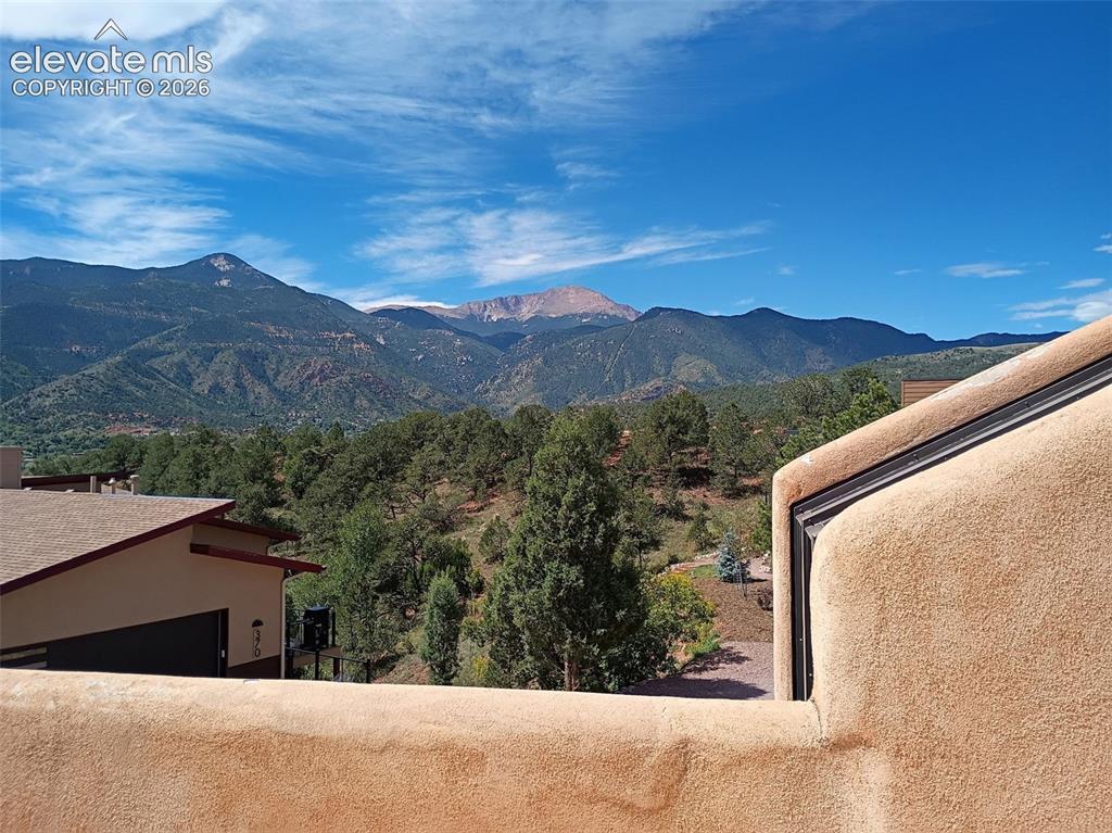 Image 42 of 46: The west facing primary bedroom deck offers a private perch with Pikes Peak