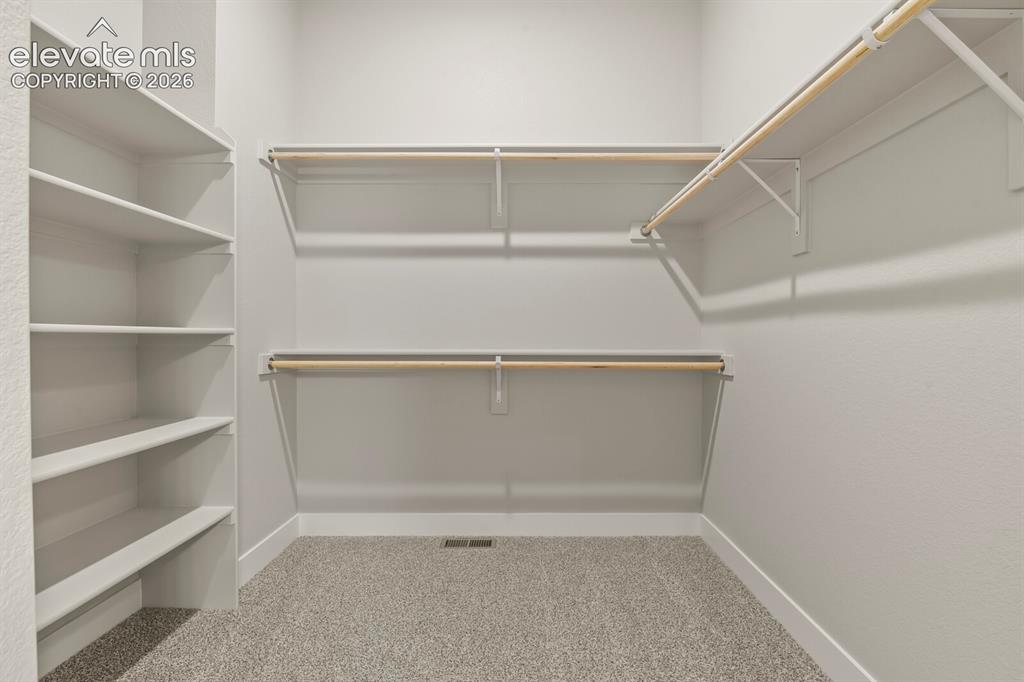 Image 12 of 40: Walk-in closet