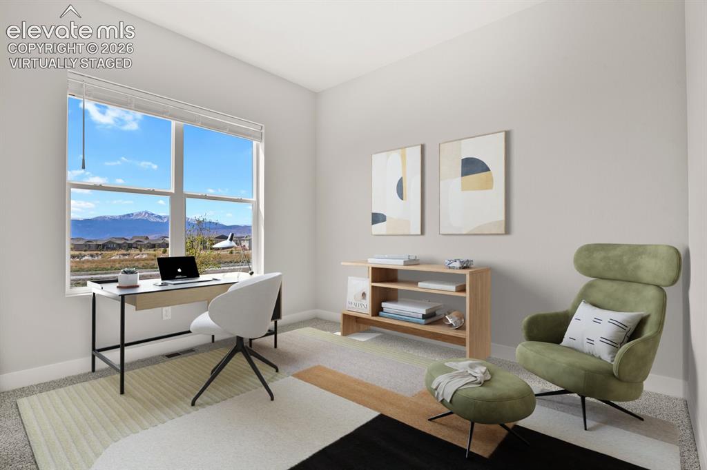 Image 13 of 40: Main level bedroom,
amazing Pikes Peak
views! Virtually Staged