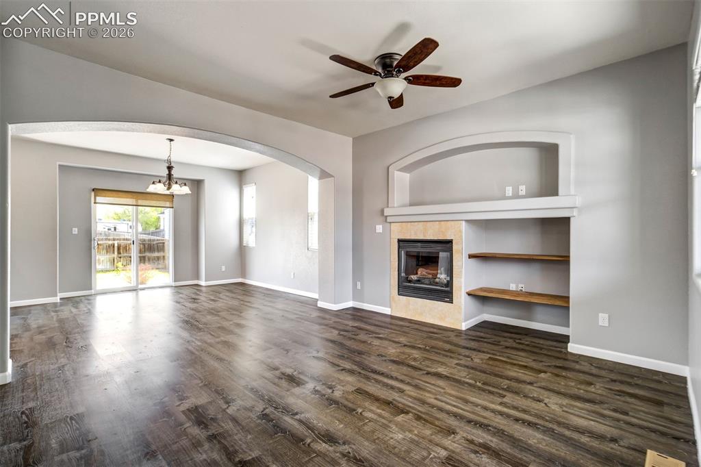 Image 7 of 48: Gas Fireplace and added shelving for entertainment center