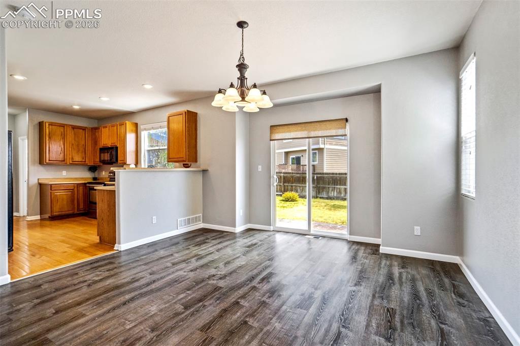 Image 9 of 48: Dining Area walks out to the backyard