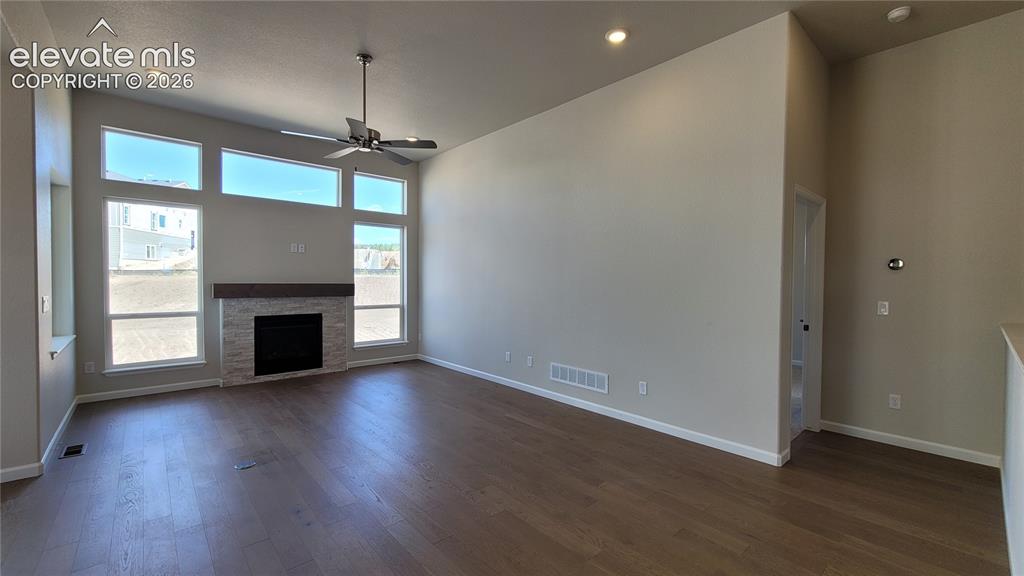 Image 11 of 47: Great Room with engineered wood flooring, floor outlet, LED lighting, ceili