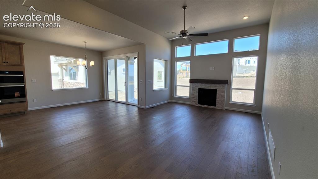 Image 12 of 47: Great Room with engineered wood flooring, floor outlet, LED lighting, ceili