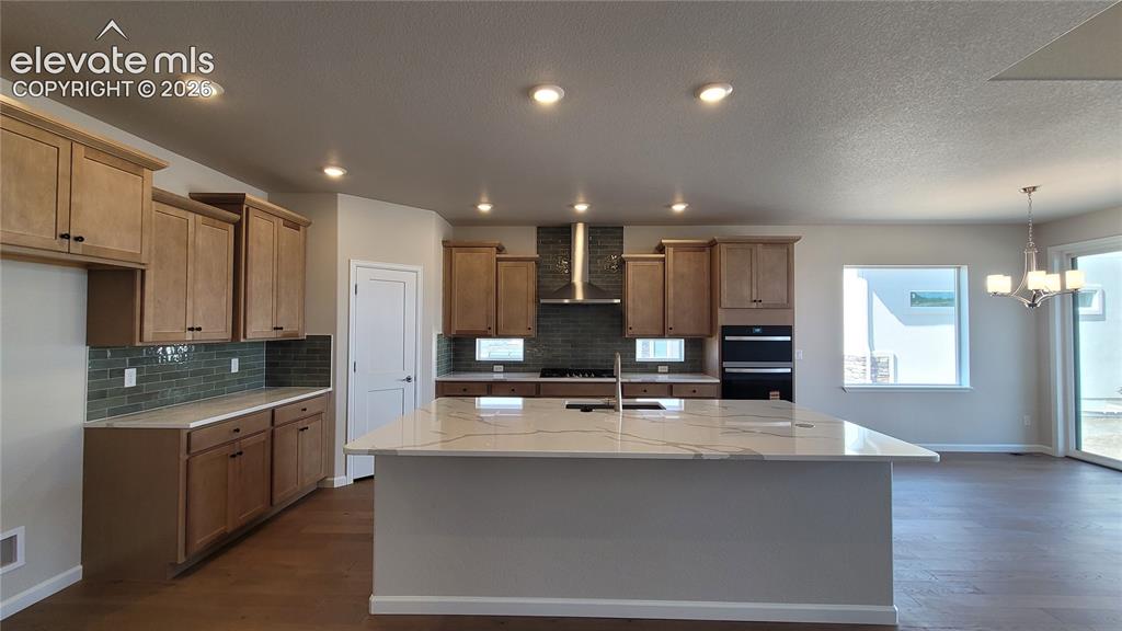 Image 4 of 47: Gourmet Kitchen with quartz countertops, pantry, huge island providing addi