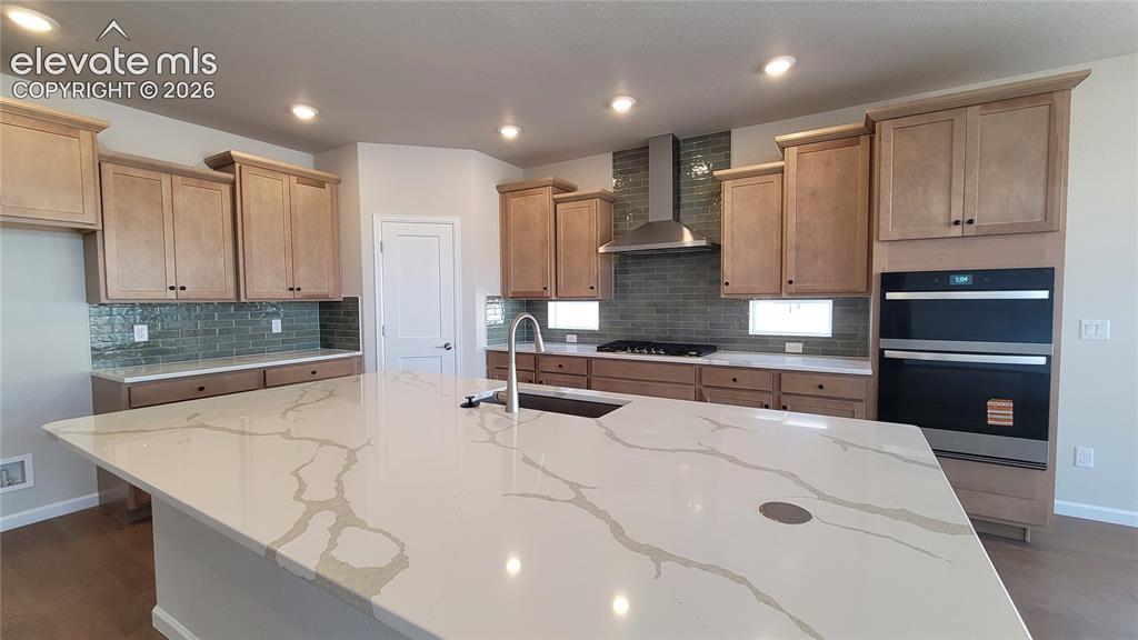 Image 5 of 47: Gourmet Kitchen with quartz countertops, pantry, huge island providing addi