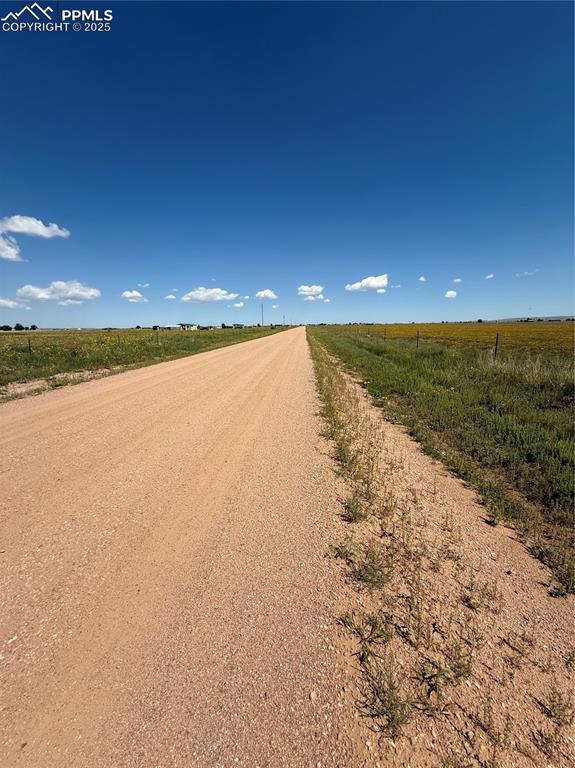 Image 3 of 4: View of dirt / gravel road featuring a view of rural / pastoral area