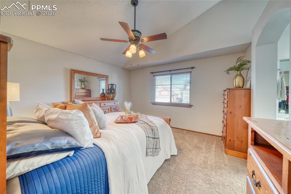 Image 18 of 46: Bedroom featuring light carpet and a ceiling fan