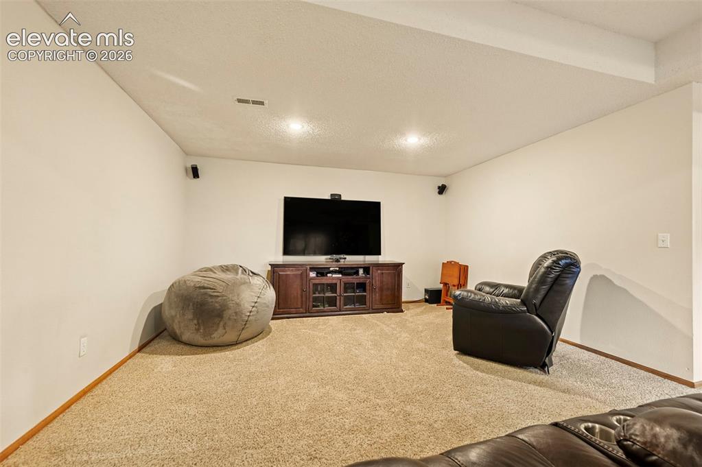 Image 30 of 50: Basement media room/2nd family room