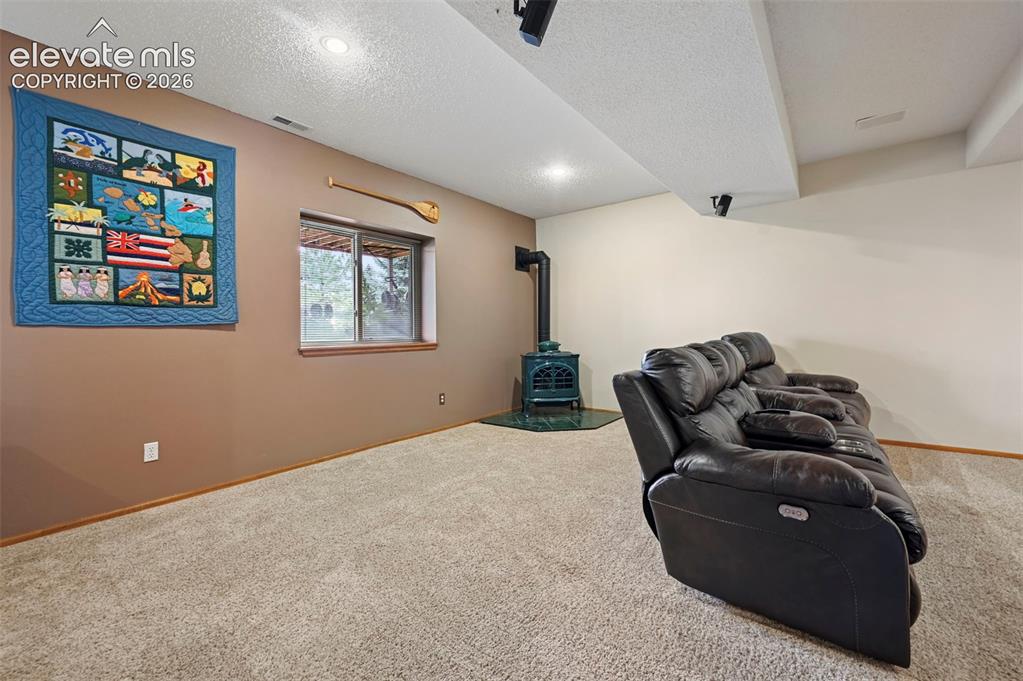 Image 31 of 50: Basement media room/2nd family room, carpeted room featuring a window, rece
