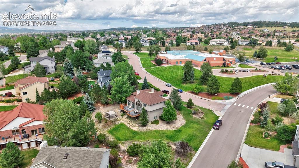 Image 43 of 50: Expansive residential neighborhood with mature trees and varied architectur