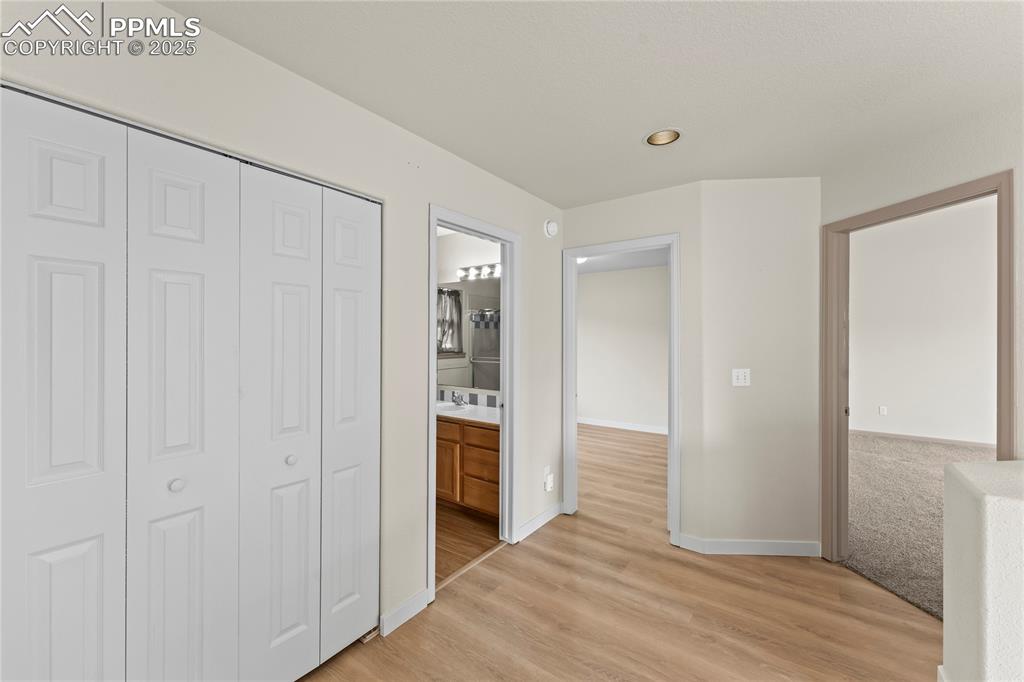 Image 16 of 38: Unfurnished bedroom featuring light wood-type flooring, a closet, recessed 