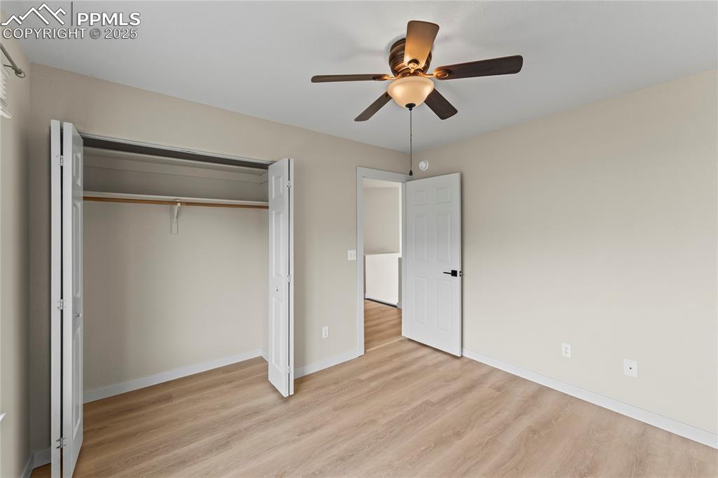 Image 18 of 38: Unfurnished bedroom featuring light wood-style flooring, a closet, and ceil