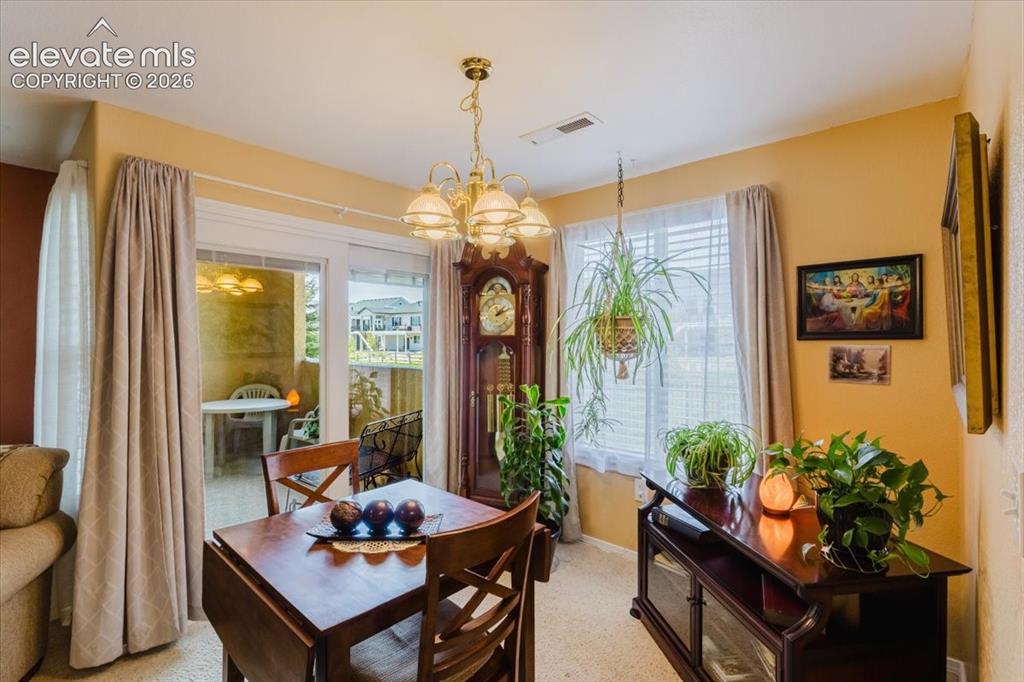 Image 10 of 39: The lovely arch welcomes you into the kitchen.