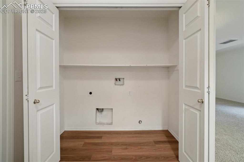 Image 30 of 43: Laundry area with laundry area, hookup for a gas dryer, electric dryer hook