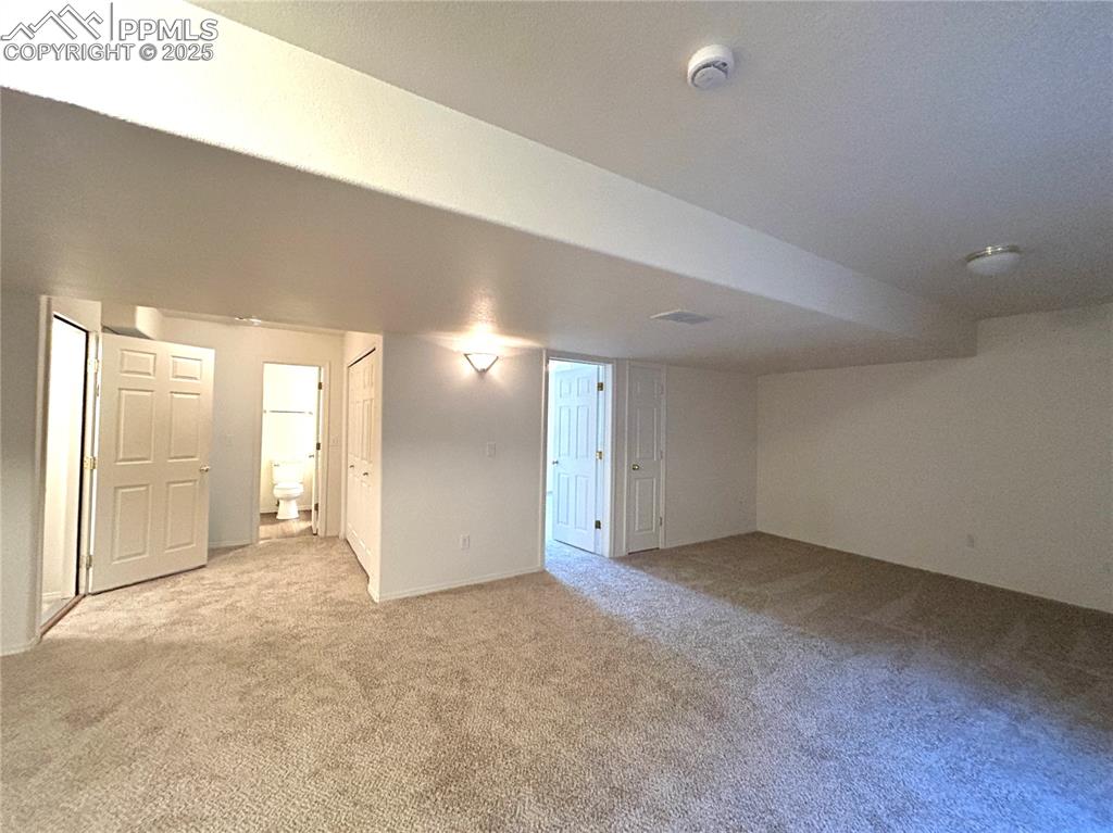 Image 33 of 43: Finished below grade area featuring carpet