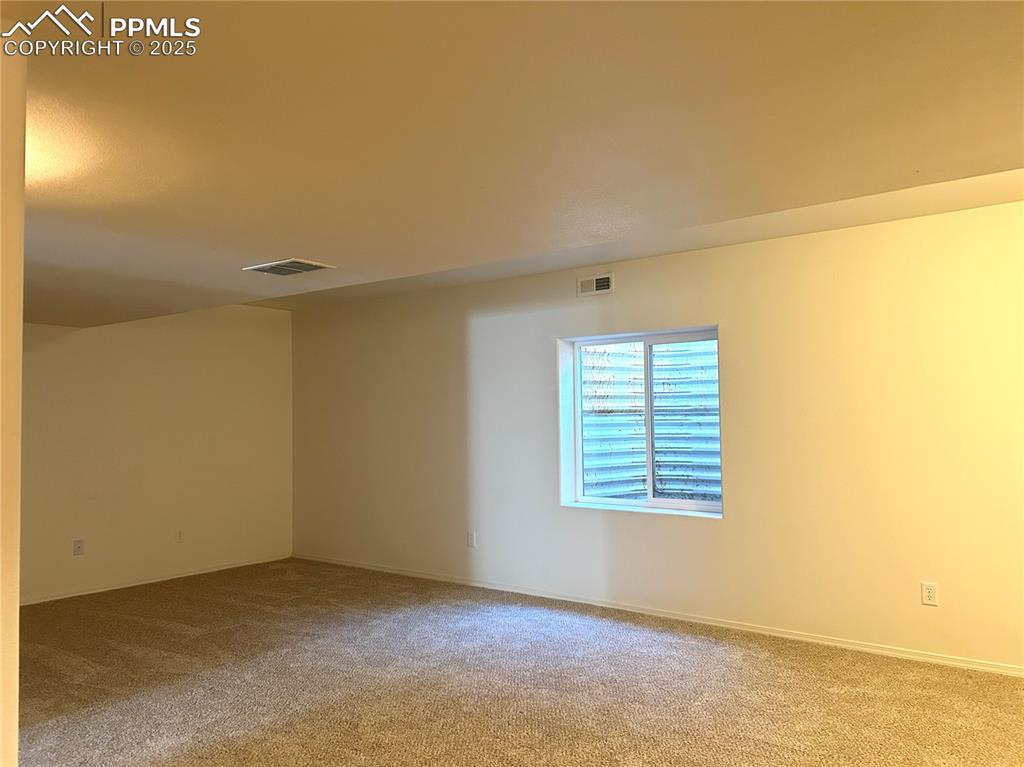 Image 42 of 43: Carpeted basement Family room