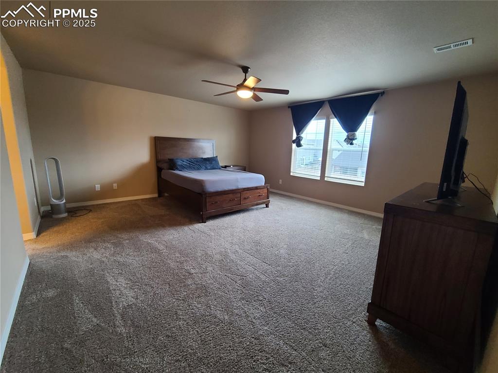 Image 15 of 29: Bedroom featuring carpet flooring and ceiling fan