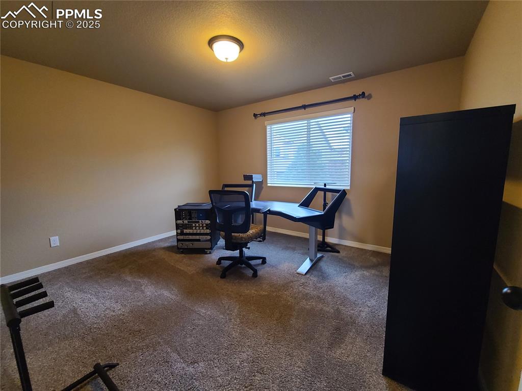 Image 26 of 29: Office featuring carpet floors and baseboards