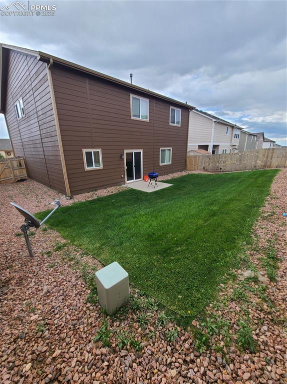 Image 28 of 29: Back of property with a patio