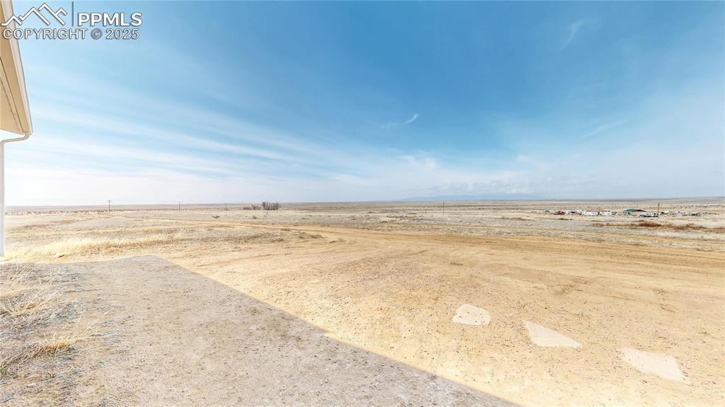 Image 29 of 40: View of yard featuring a view of countryside and view of desert