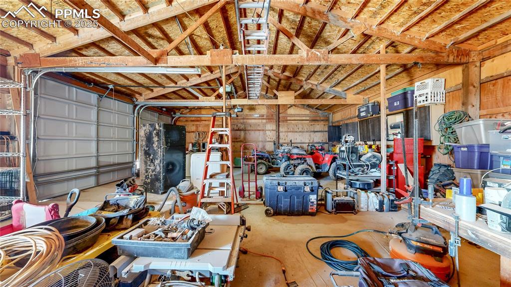 Image 35 of 40: Garage with washer / dryer