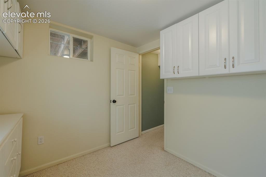 Image 34 of 49: Room featuring light-colored walls and neutral-toned carpeting