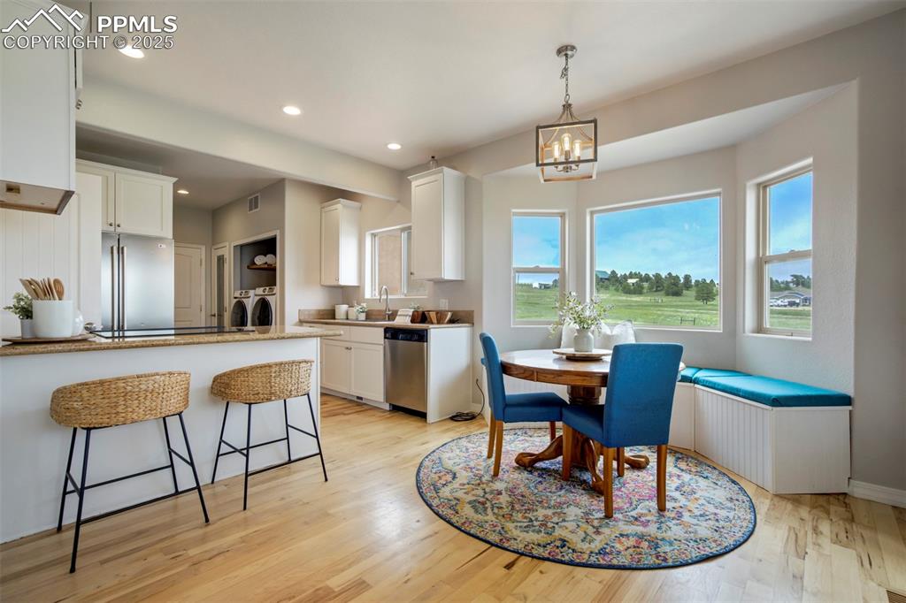 Image 5 of 43: Dining area with built in bay window bench