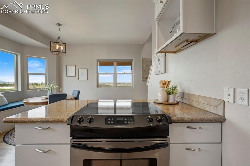 Image 8 of 43: Island with granite and stainless 