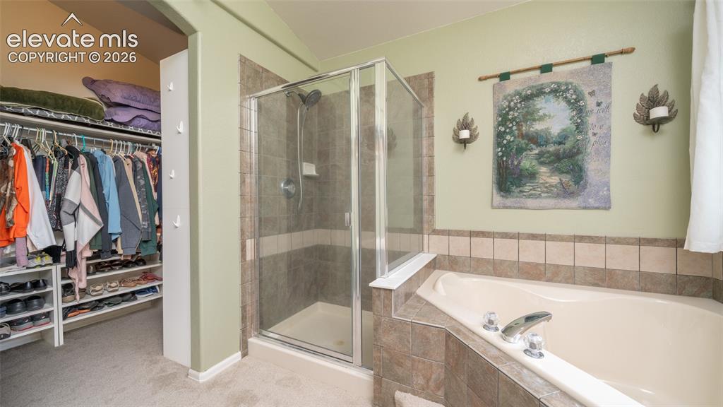 Image 16 of 42: Master shower + closet