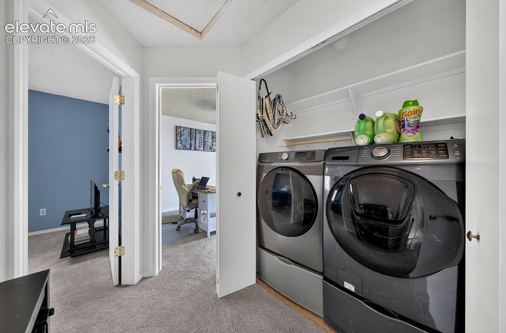 Image 17 of 30: Dedicated laundry closet with shelving