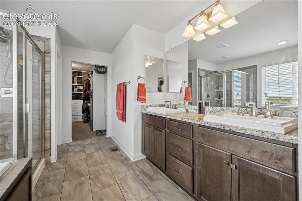 Image 13 of 39: Carpeted bedroom featuring crown molding, a ceiling fan with integrated lig