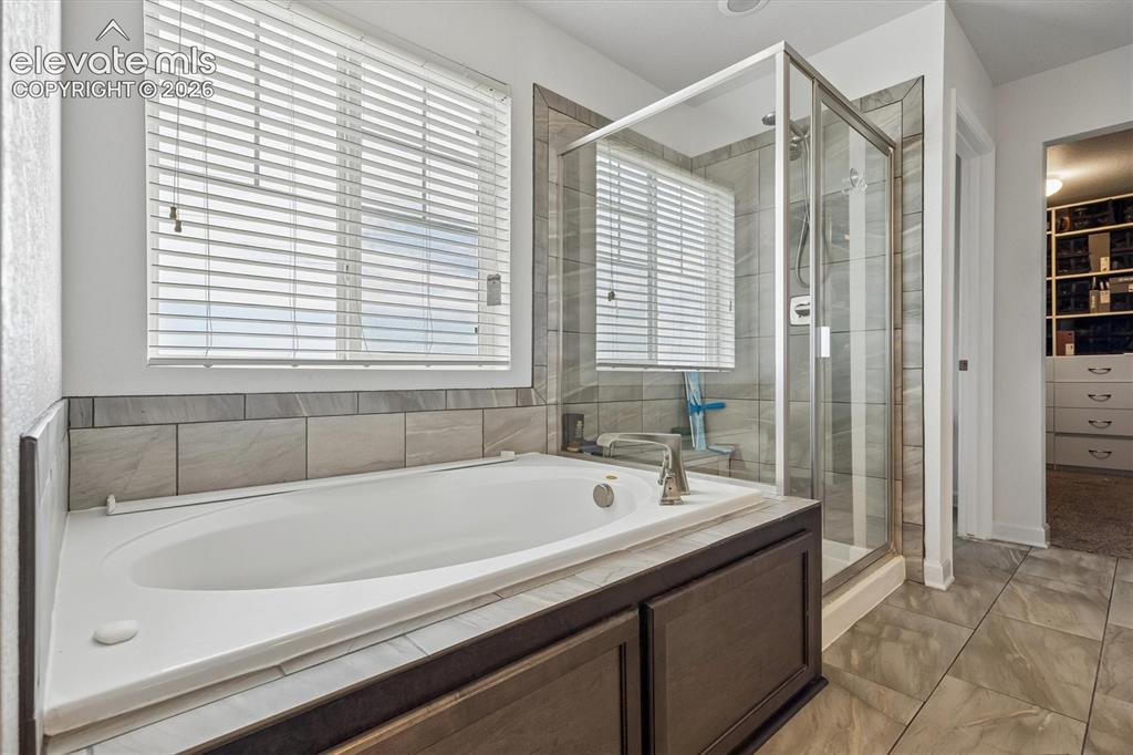 Image 14 of 39: Dual vanity with vessel sinks and granite-finish countertops