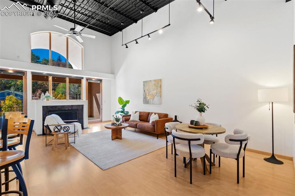 Image 7 of 38: Open floor plan featuring the living room, dining room, and natural light t