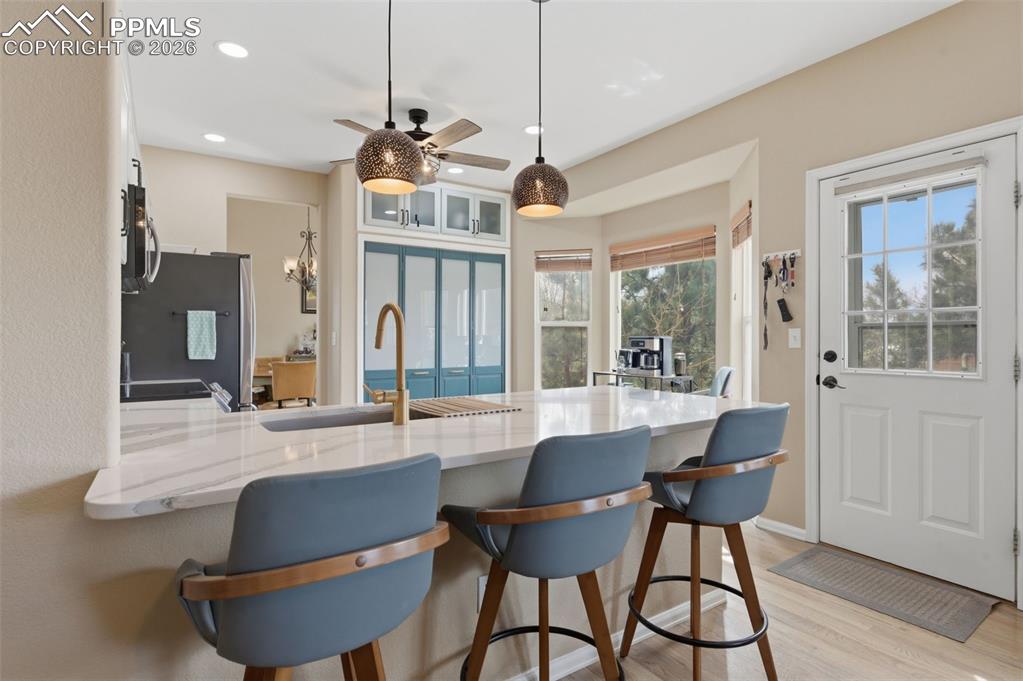 Image 10 of 50: Kitchen breakfast bar view from family room