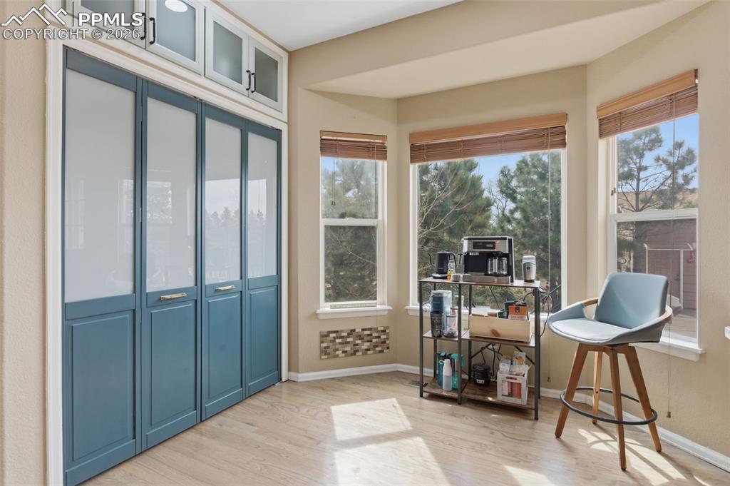 Image 12 of 50: Kitchen cabinets/storage with eat-in area