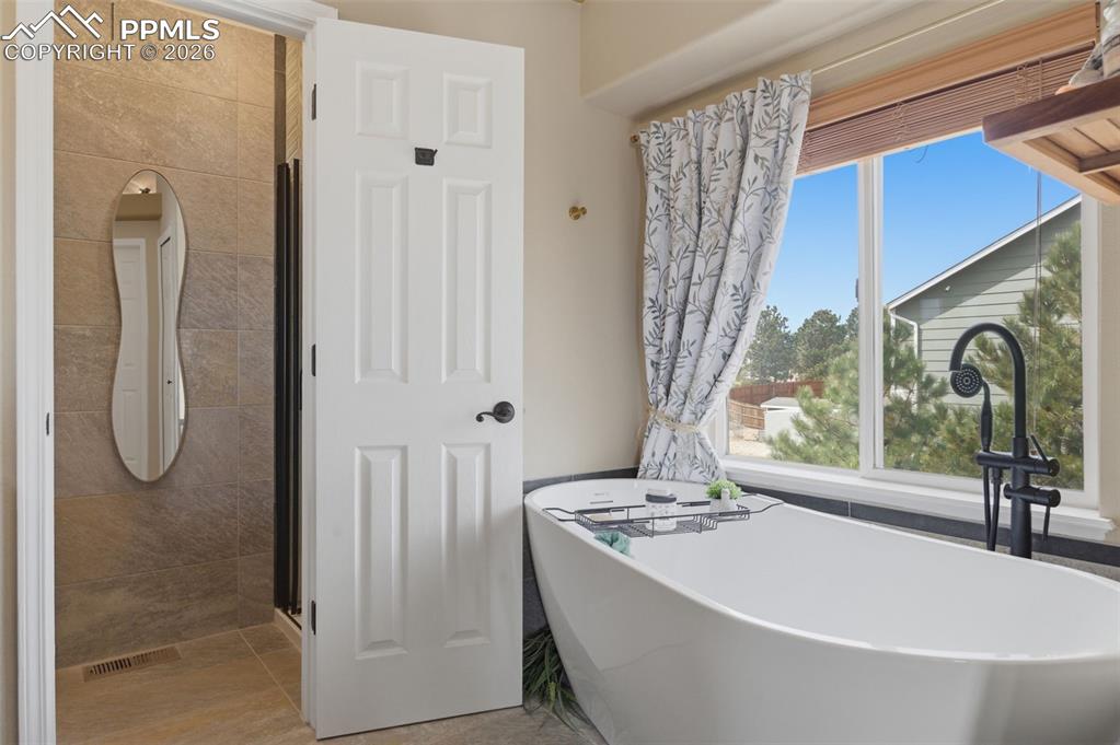 Image 17 of 50: Primary spa bathroom