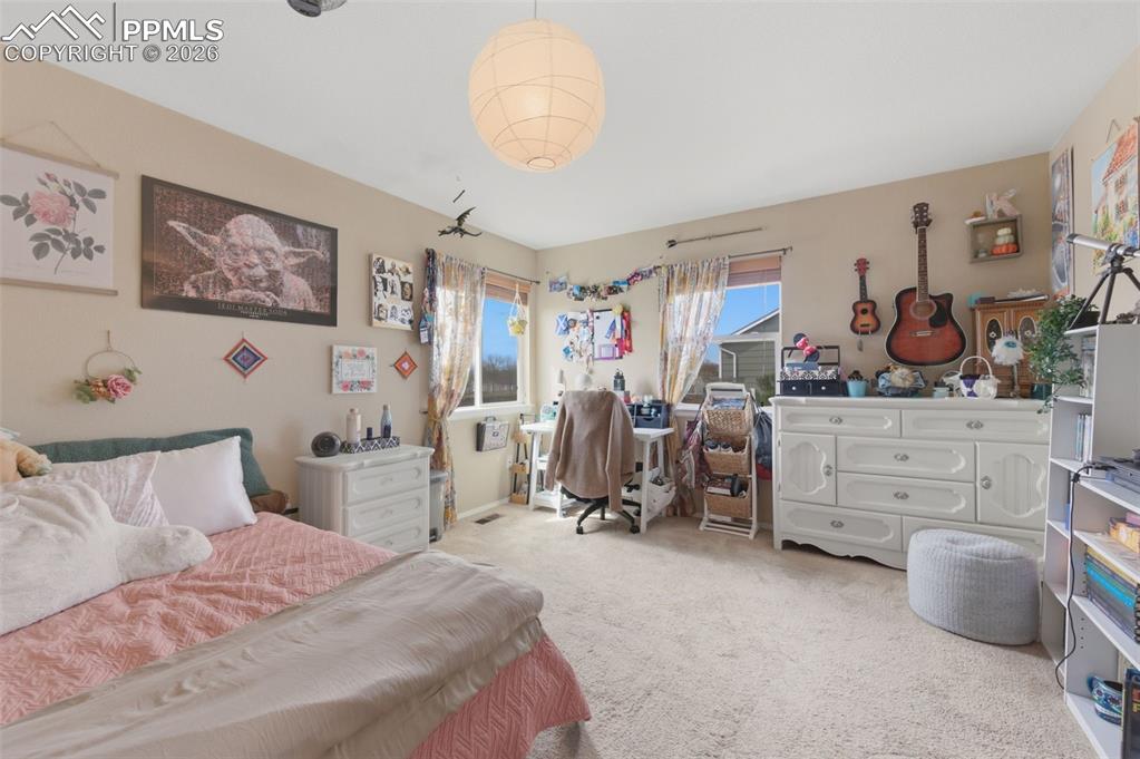 Image 20 of 50: Upper level bedroom