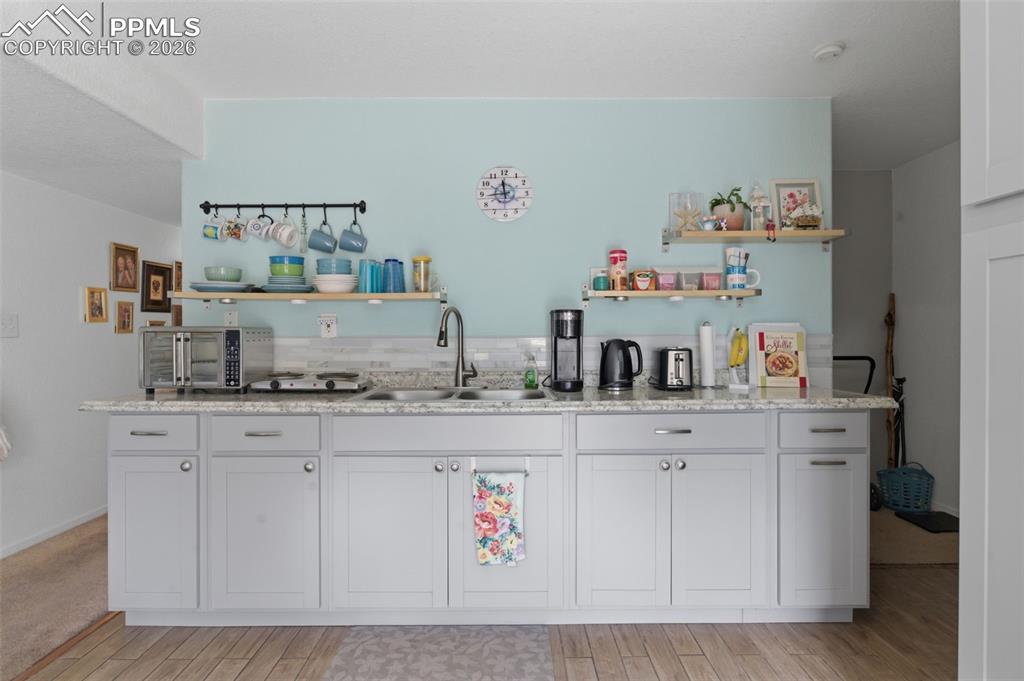 Image 26 of 50: Basement kitchenette/wet bar