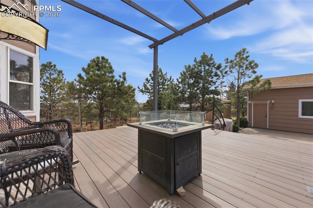 Image 35 of 50: Deck and firepit