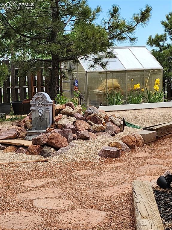 Image 39 of 50: green house in action during season