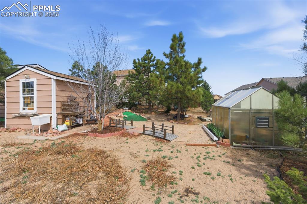 Image 41 of 50: Shed and Greenhouse with power