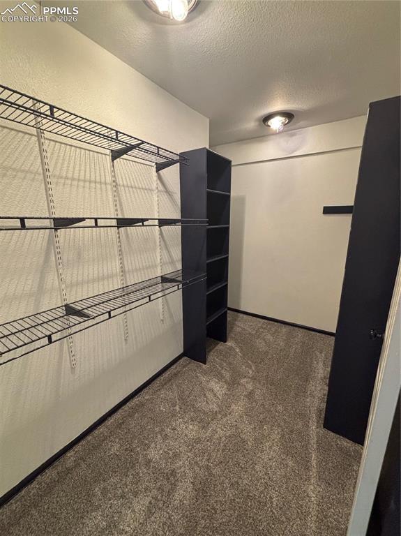 Image 17 of 34: Primary bedroom walk in closet