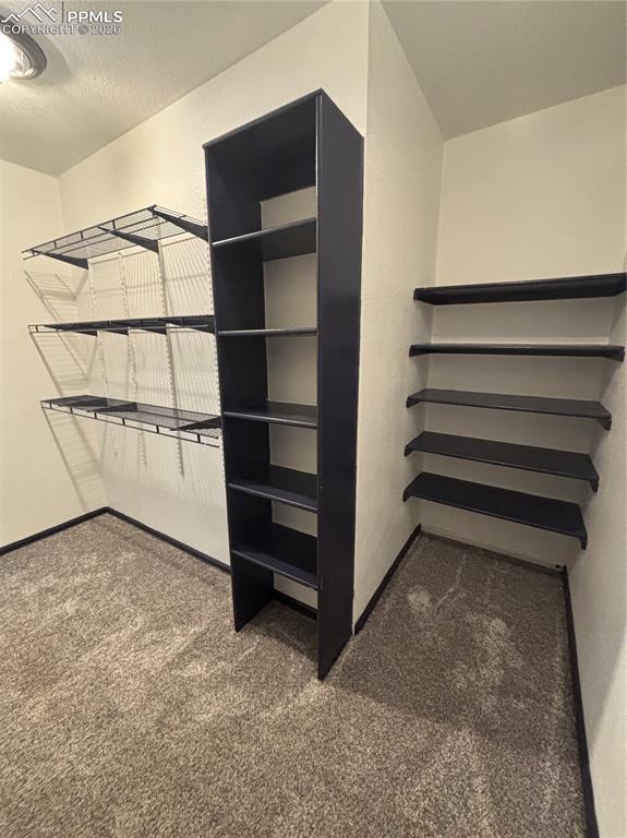 Image 18 of 34: Primary bedroom walk in closet