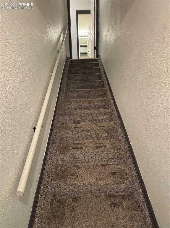 Image 19 of 34: stairs to lower level