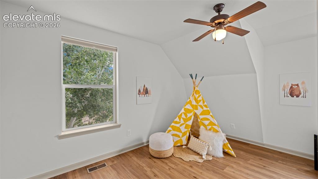 Image 23 of 45: Upstairs bedroom with beautiful new floors!!