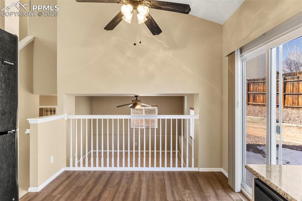 Image 13 of 25: Dining room looking into lower level